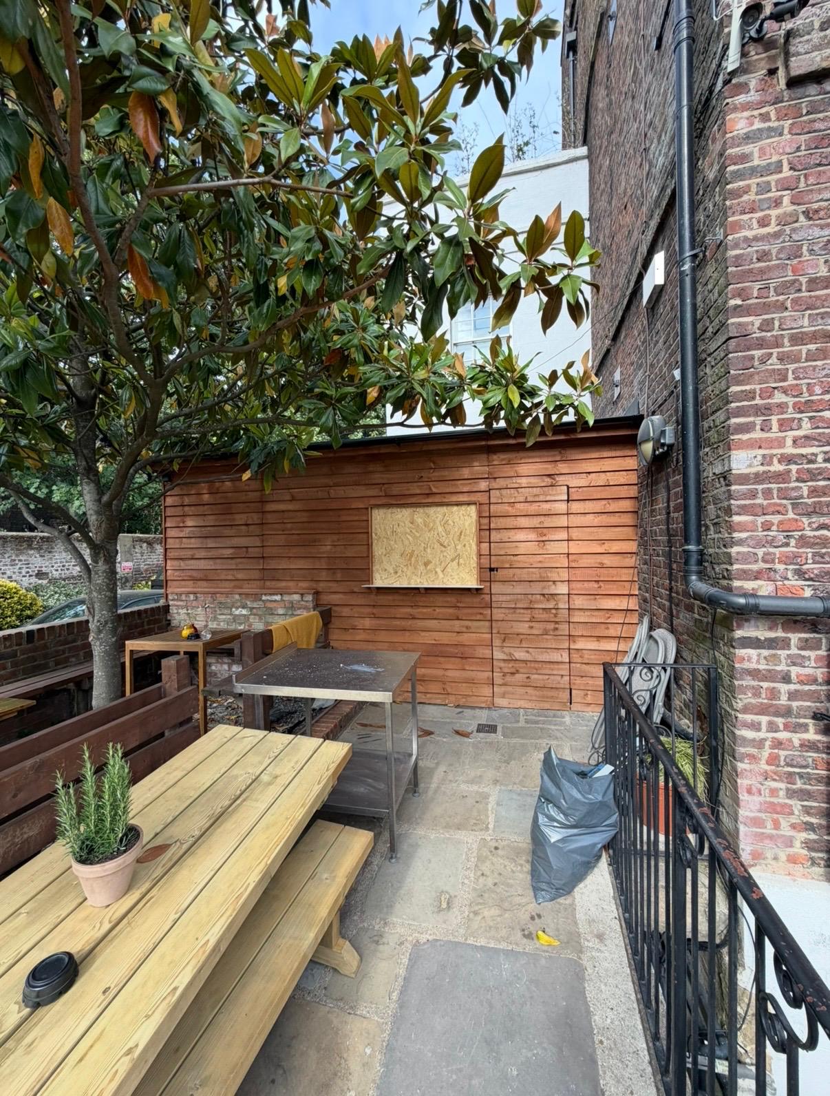 Newly built timber-clad external kitchen