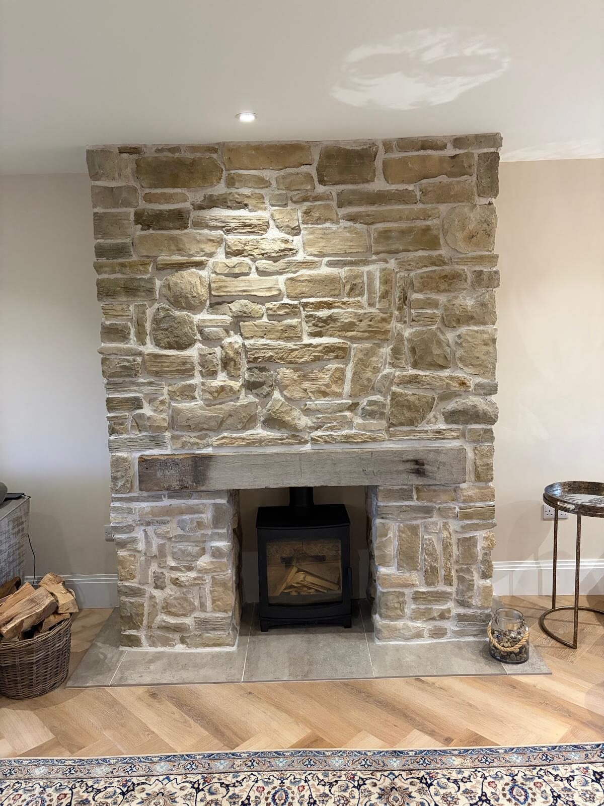 Stone feature fireplace with log burner, London & Essex